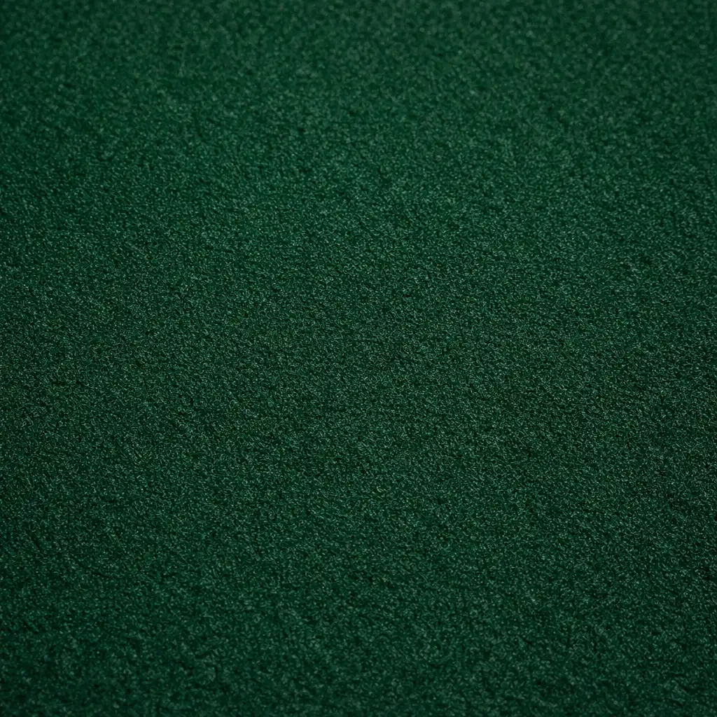 Macro view of the dark green felt texture on a poker table